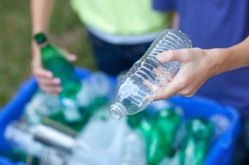 Residential waste bins organized for collection in Bow